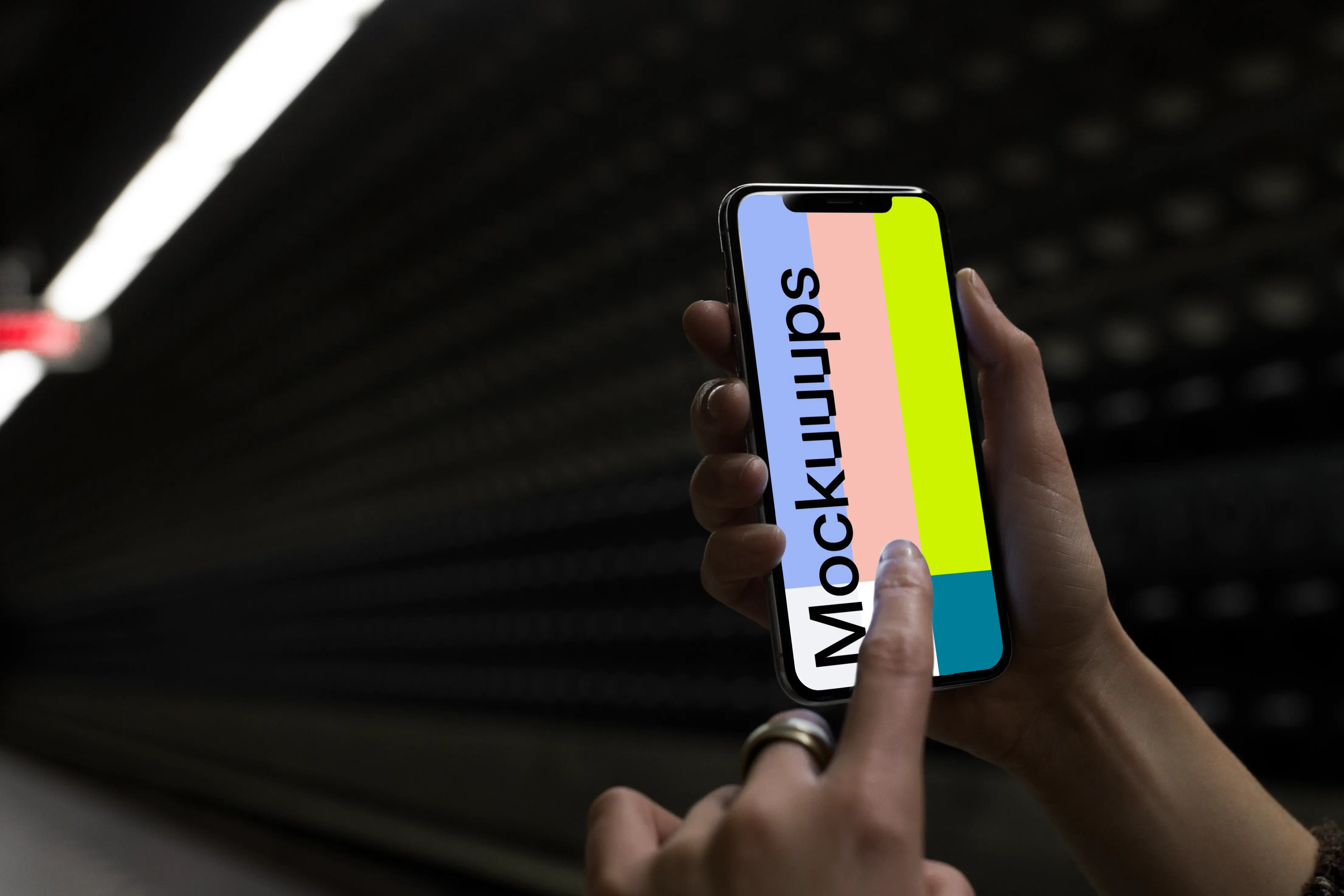 Woman with iPhone X mockup in underground station