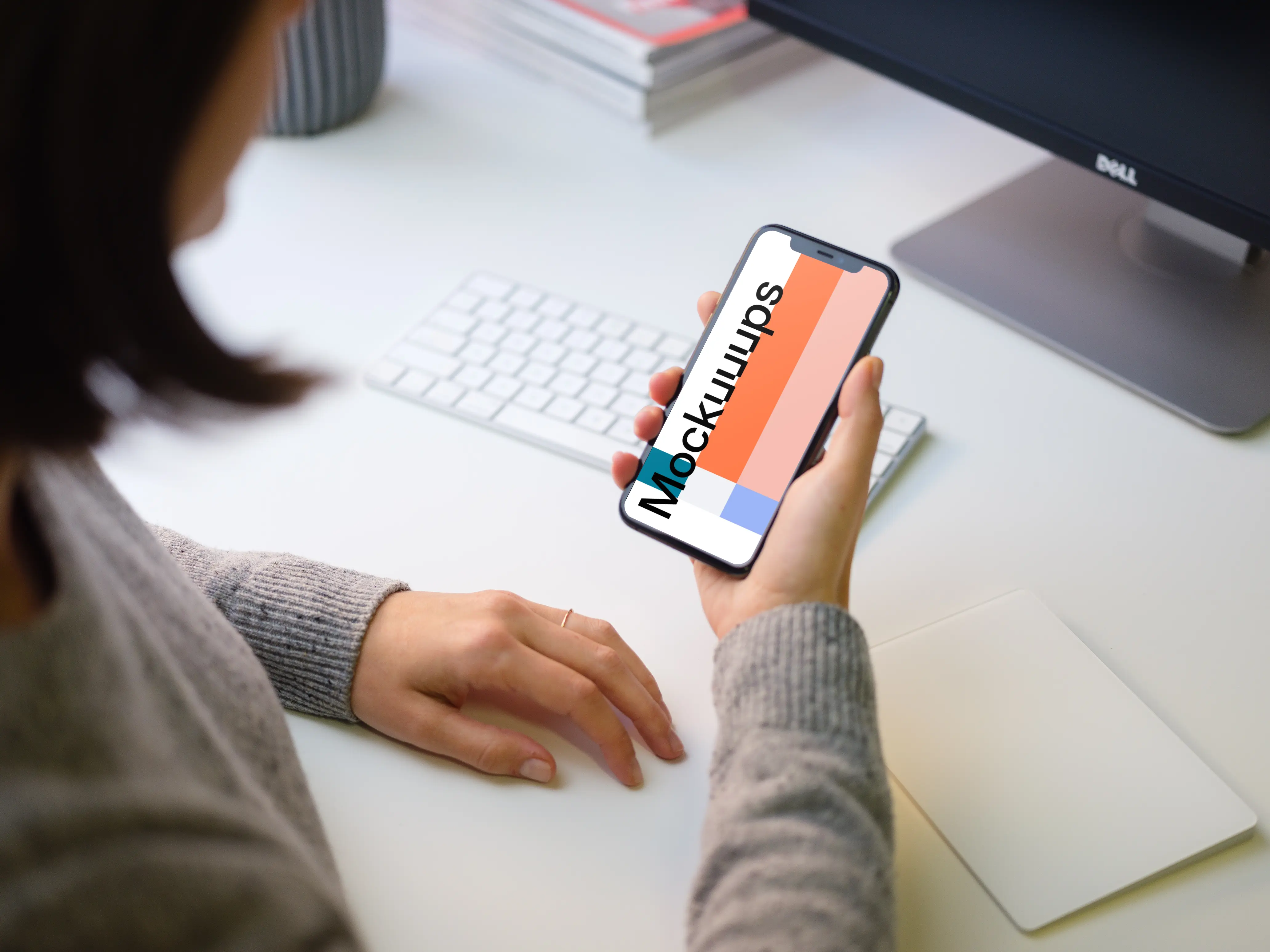 Young woman holding iPhone 11 mockup