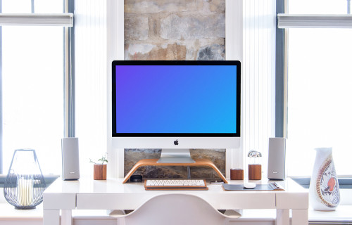 iMac mockup on a table with a keyboard and a mouse 