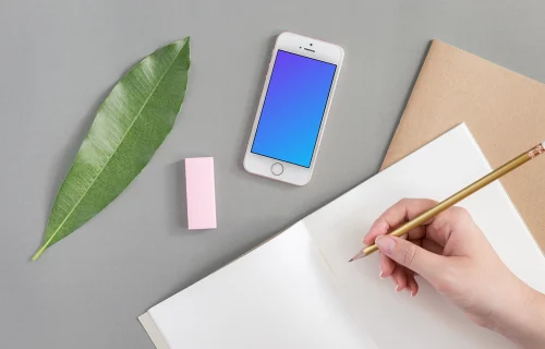 iPhone SE mockup next to the journal