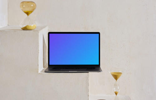 MacBook mockup on staircase with hourglass at the side