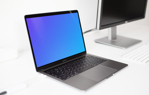 Macbook Pro mockup on the white table
