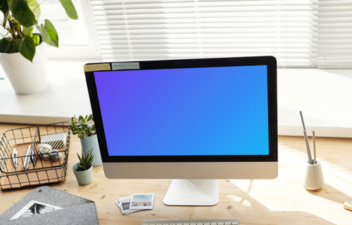 Mockup of a young girl using her iMac with a note by the side