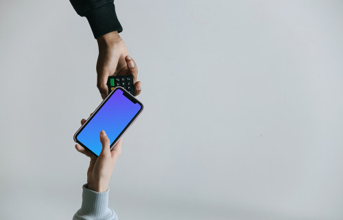 Top view of person using contactless payment with iPhone mockup