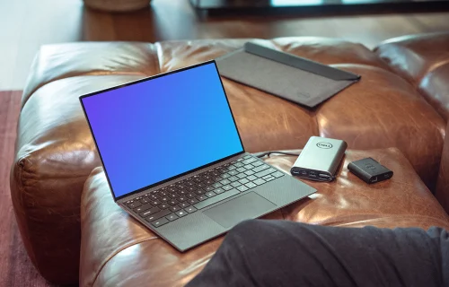 Dell XPS mockup en el sofá con el cargador