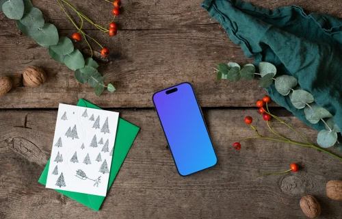 Navidad mockup con un teléfono y una tarjeta de felicitación