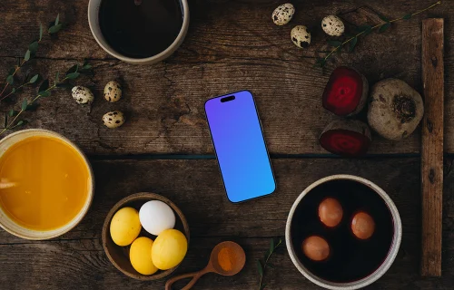 Coloring Easter eggs next to a smartphone mockup