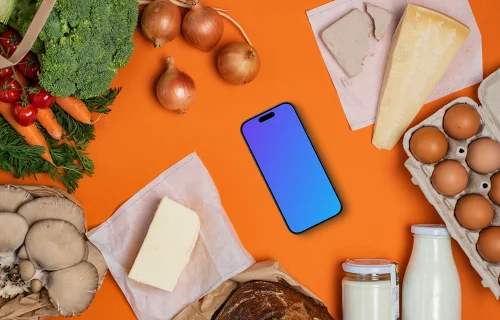 Device mockup in the middle of fresh groceries