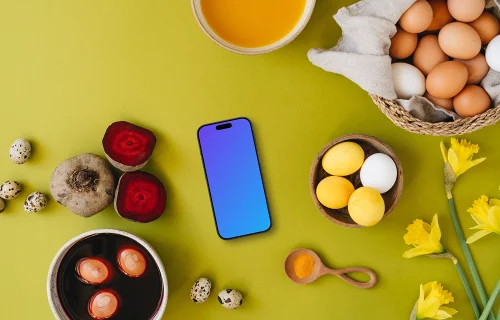 Coloration d'œufs de Pâques autour d'un smartphone mockup