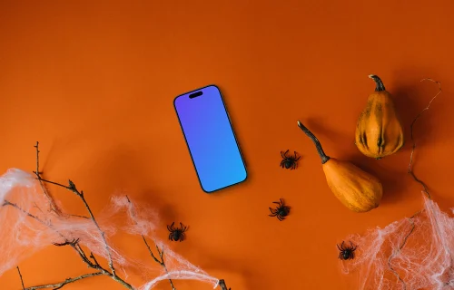 Fundo de Halloween mockup com um smartphone e aranhas