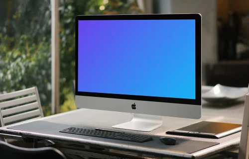 iMac mockup on a conference table