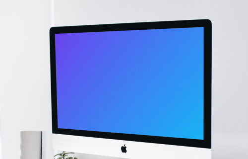 iMac mockup on a wooden stand in a home workstation