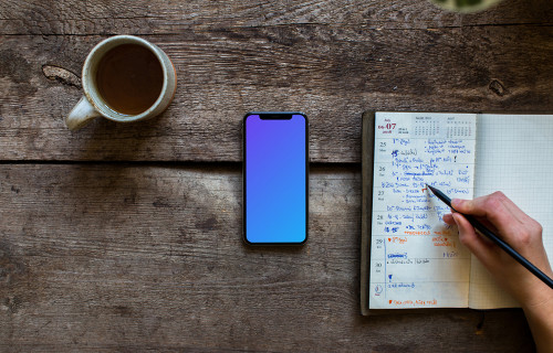 iPhone XS mockup on wooden table
