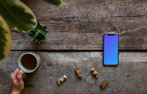 iPhone XS mockup with a tea on the left side