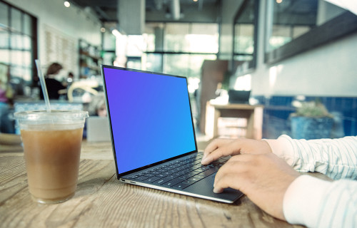 Dell XPS Mockup on table with drink at the side