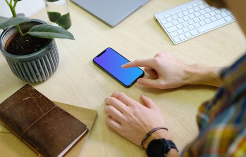 Man tapping on the iPhone 11 mockup screen