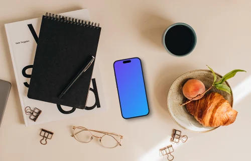 Mockup of smartphone lying on the student desk