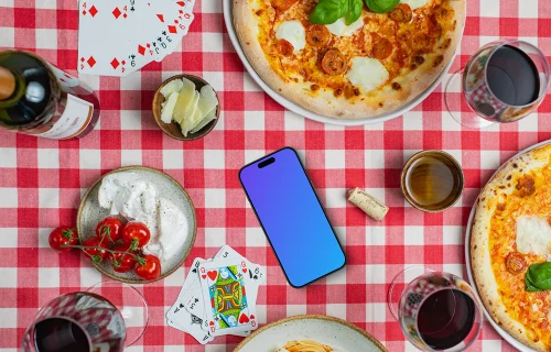 Phone mockup on checkered tablecloth with pizzas