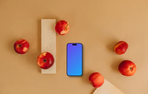 Phone mockup surrounded by apples