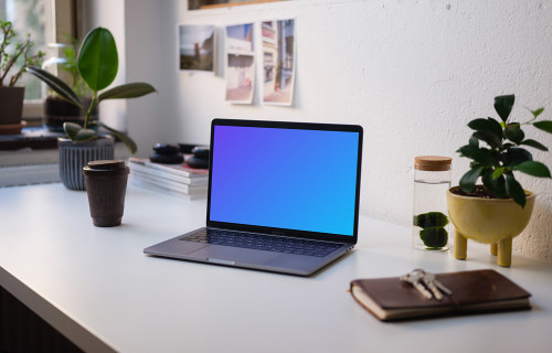 Side view of the Macbook Pro mockup on white table