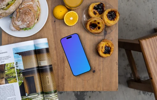 Smartphone mockup dans un café avec des pâtisseries