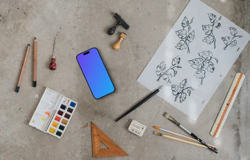 Smartphone mockup next to the painting accessories