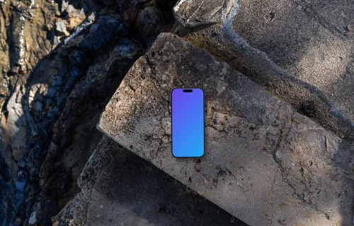 Smartphone mockup on a rocky surface