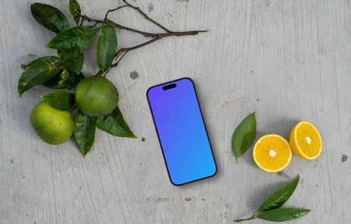 Smartphone mockup sobre una mesa con cítricos