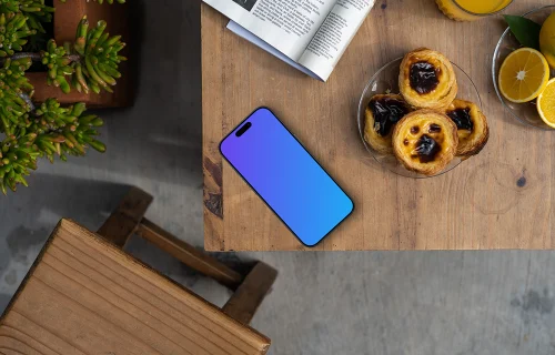 Smartphone mockup on an edge of a table