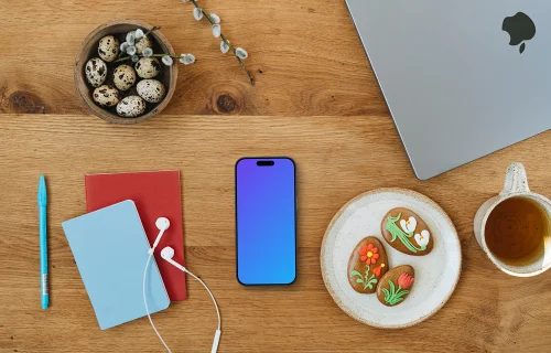 Smartphone mockup entouré de décorations de Pâques