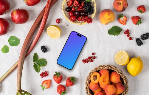 Smartphone mockup entouré de fruits