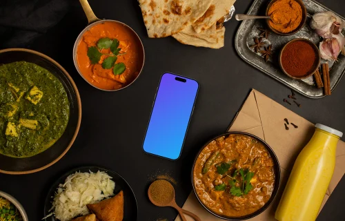 Smartphone mockup rodeado de comida india