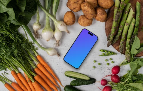 Smartphone mockup entouré de légumes