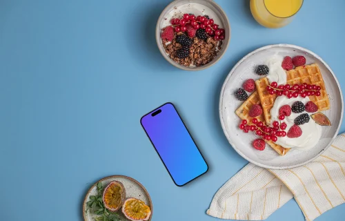 Smartphone mockup con platos de desayuno