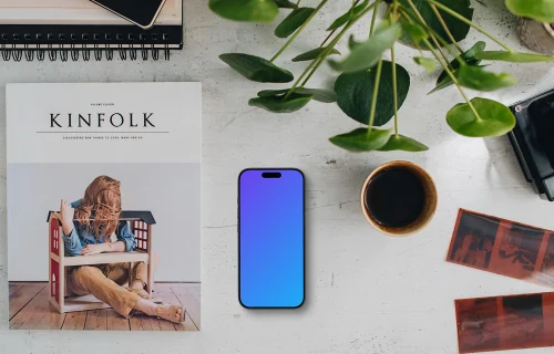 Top view of office desk with a phone mockup