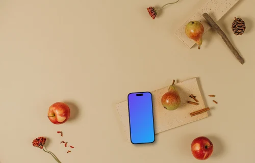 Top view of phone mockup with apples around