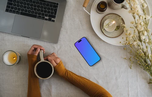 Top view of smartphone mockup with a coffee