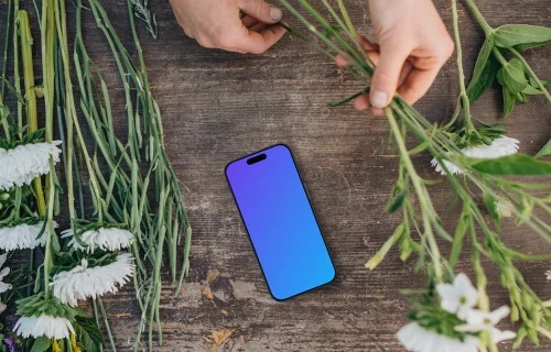 Vue de dessus du smartphone mockup avec des fleurs