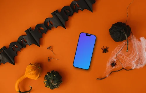 Vue du dessus du téléphone mockup avec des décorations d'Halloween