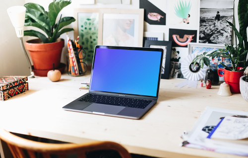 Wide view mockup of the creative workspace with Macbook Pro