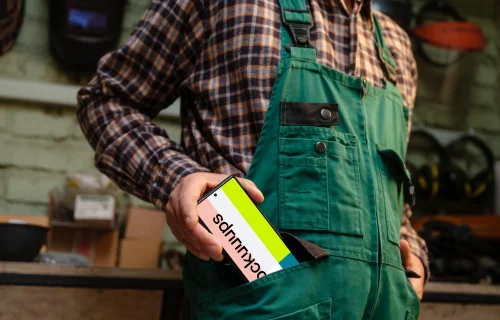 Crafter pulling out a phone from his pocket