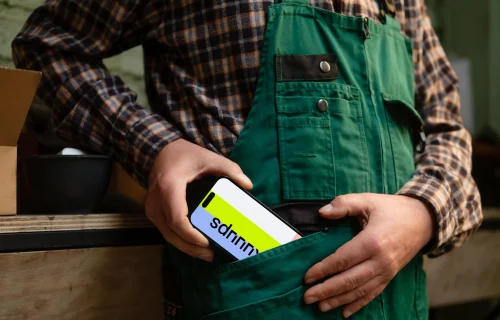 Crafter pulling out an iPhone from his pocket