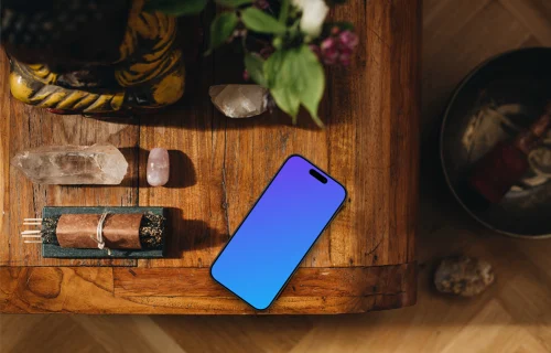 Crystals and minerals next to the iPhone mockup