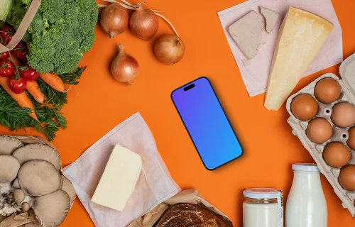 Device mockup in the middle of fresh groceries