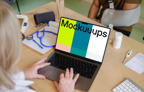 Doctor typing on a MacBook mockup