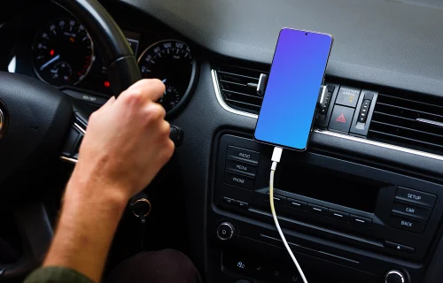Driver using Samsung S20 mockup mounted while driving