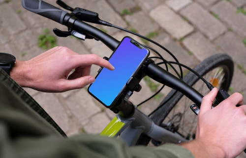 Tapping on iPhone 11 Pro mockup mounted on a bike