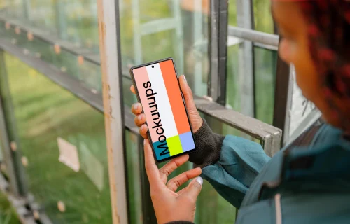 Female construction worker holding a Google Pixel mockup