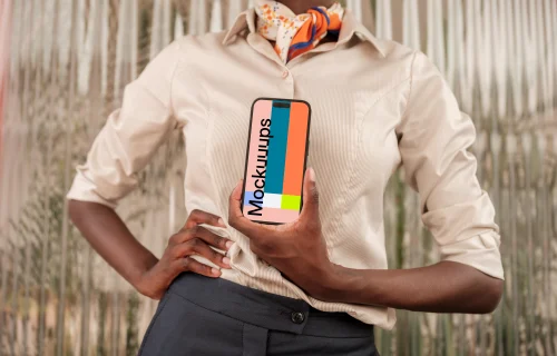 Female entrepreneur holding an iPhone mockup