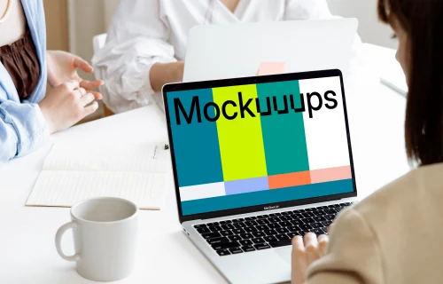 Female using a MacBook Pro mockup in a meeting